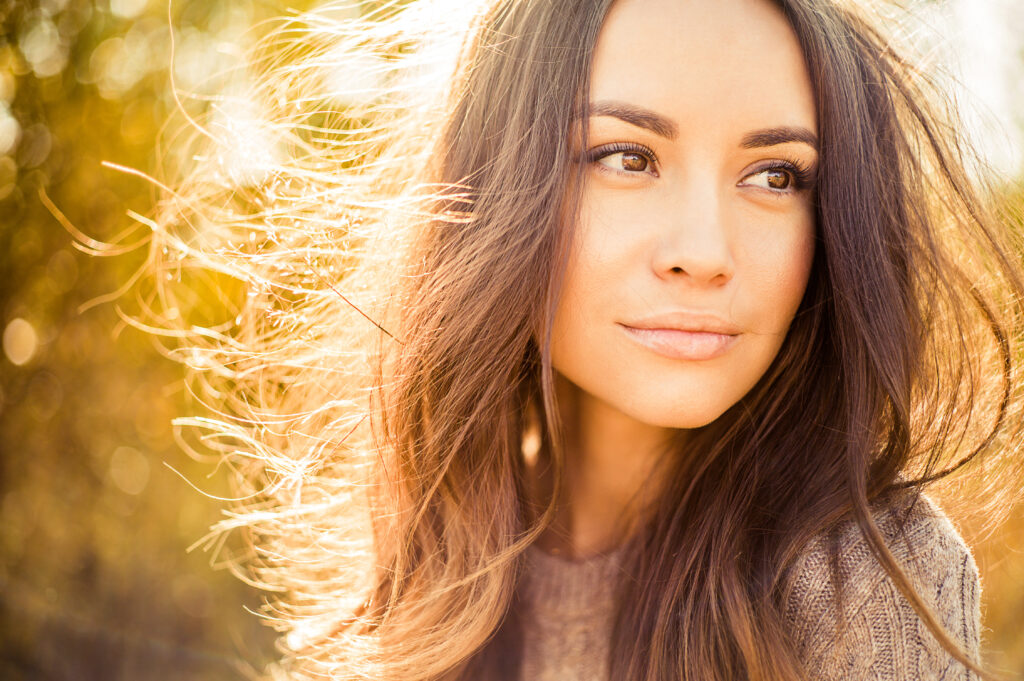 Portrait of a beautiful lady with sun rays falling on her hair | Restylane in Walnut Creek, CA | Walnut Creek Aesthetics
