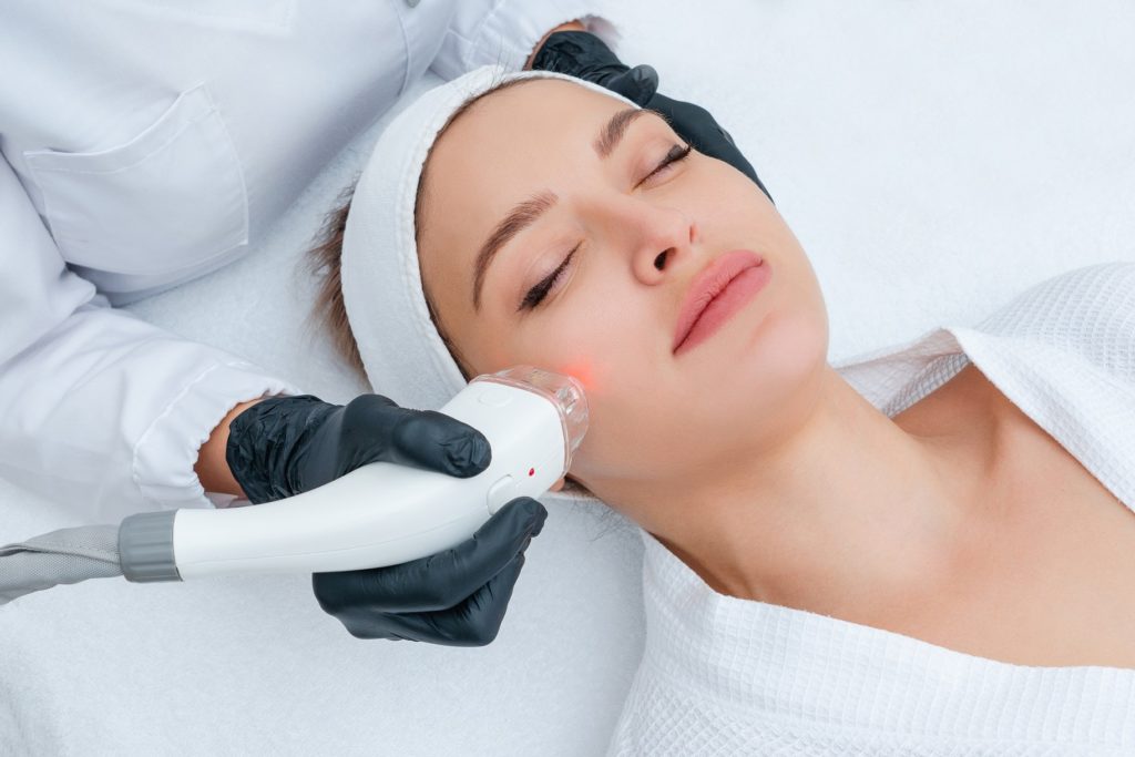 Young woman receiving laser treatment| Laser Genesis in Walnut Creek, CA | Walnut Creek Aesthetics